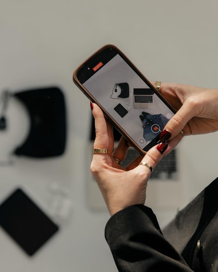 Founder filming brand content with a phone in a creative studio