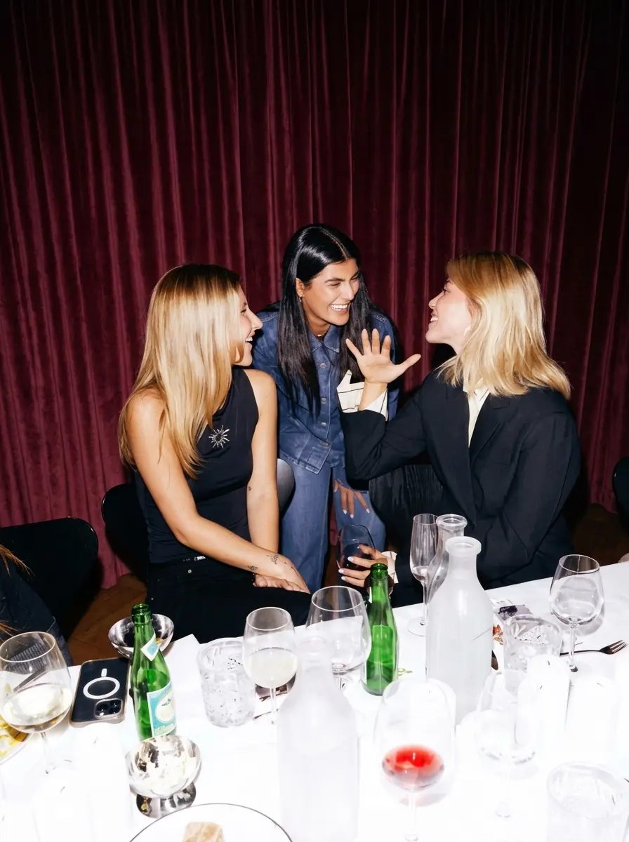 Members sharing conversation around a private dinner table