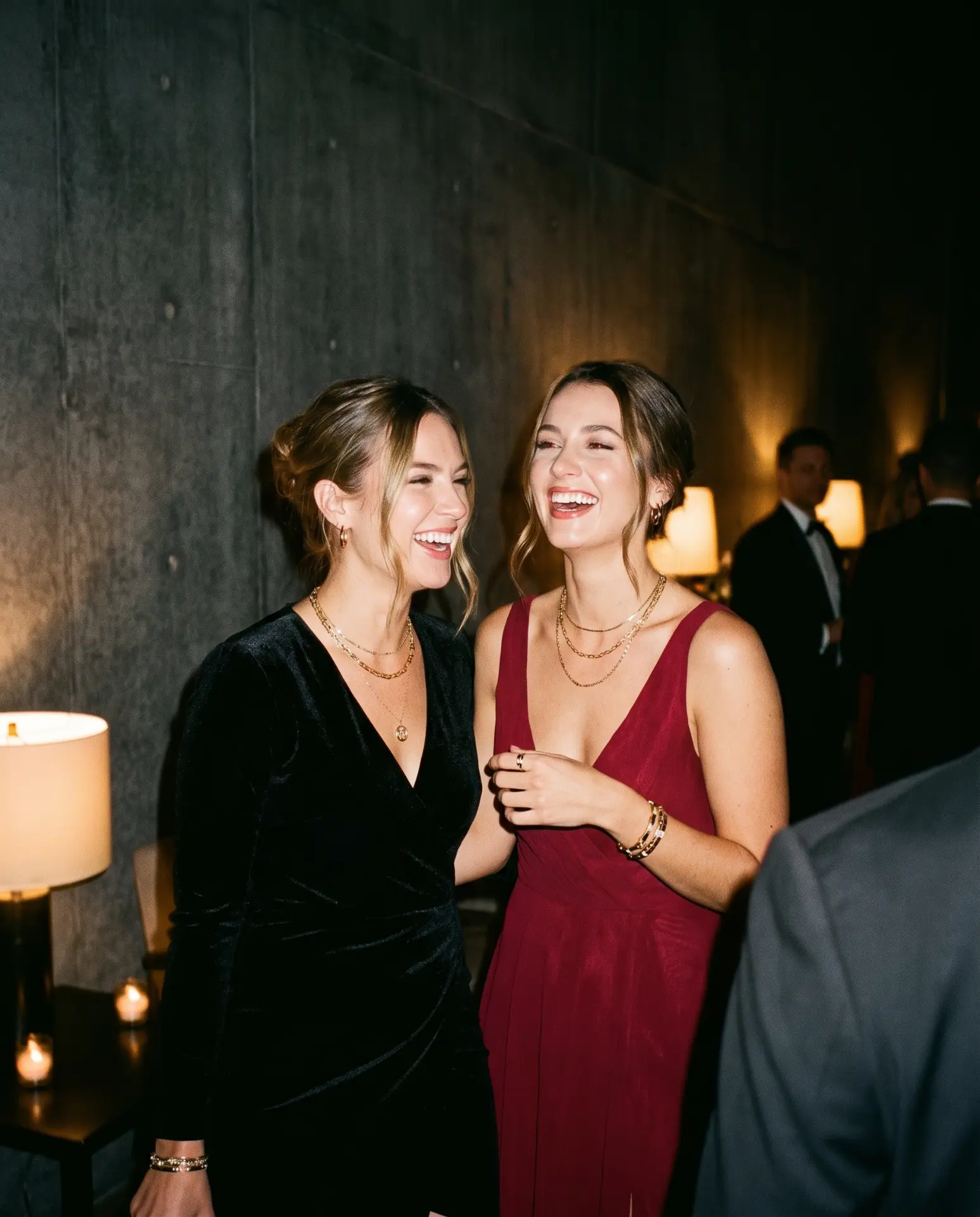 Members laughing together at an evening gathering