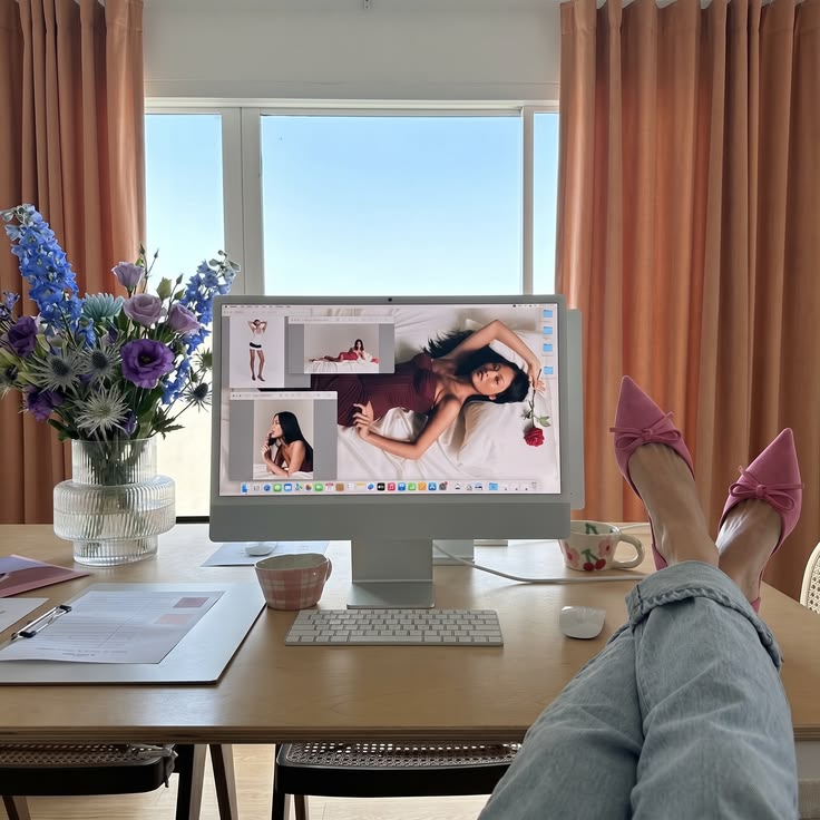 Creative workspace with campaign imagery displayed on a desktop computer